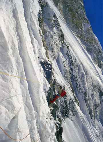 
Ian Clough traversing the fixed ropes on the steepest part of the Ice Ridge on Annapurna South Face in 1970 - Annapurna South Face book cover
